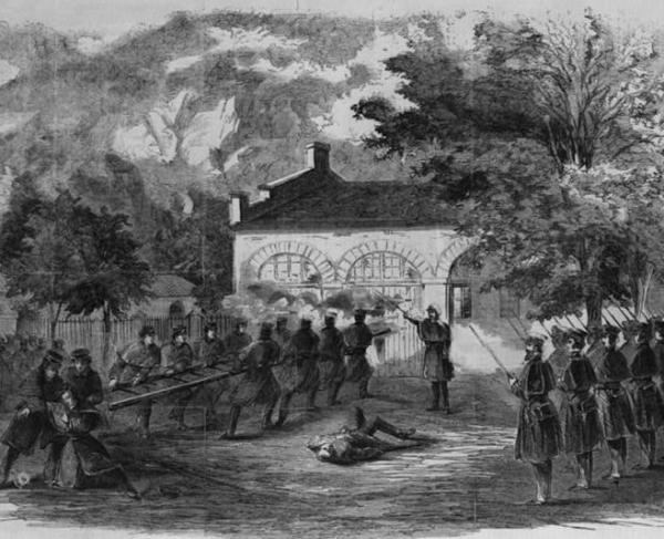 The Harper's Ferry insurrection--The U.S. Marines storming the engine house--Insurgents firing through holes in the doors
